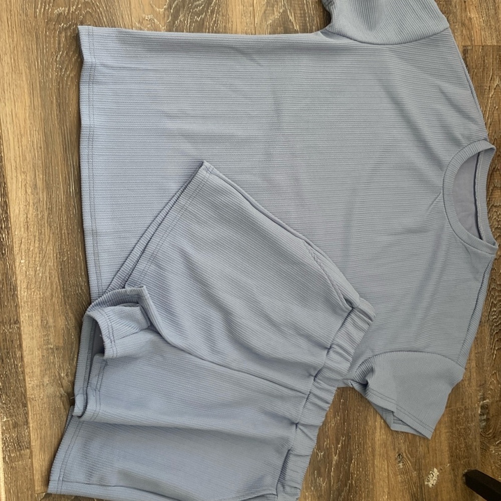 Womens top and shorts powder blue size large never worn